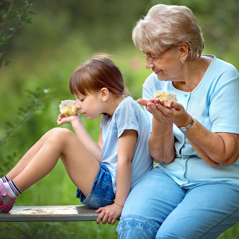 elderly woman and child with muffins