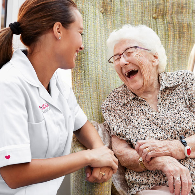 nurse laughing with patient